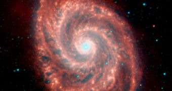 This image of the Whirlpool Galaxy and its companion shows a cosmic collision in full swing