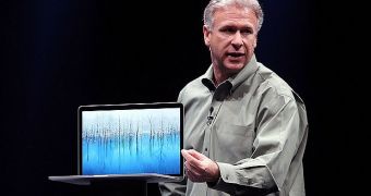 Apple's Phil Schiller showing off the new MacBook Pro with Retina display