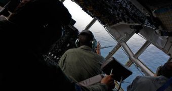 Brazilian rescue teams use a C-130 Hercule heavy transport aircraft to scout the surface of the Atlantic for signs of Flight 447. The pilot is flying the craft at a very low altitude
