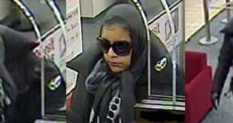 An unidentified woman robs 2 banks in 15 minutes