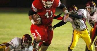 Football player Tony Picard weighs 400 pounds (181.4 kg) and is unstoppable on the field