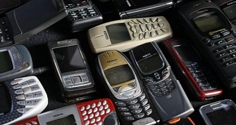 A cluster of old Nokia phones