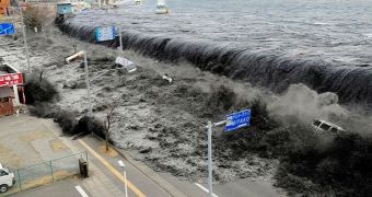 Tsunami flooding a street after earthquake in Japan