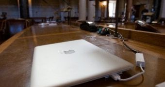 A MacBook Air gleaming atop a senator's desk at the State Capitol in Lincoln