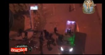 Footage showing riot policemen beating an Egyptian