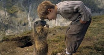 Boy has Alpine marmots as his best friends (click to see picture)