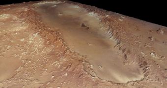 Orcus Patera is an enigmatic elliptical depression located between the volcanoes of Elysium Mons and Olympus Mons
