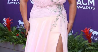 Beth Chapman shows off ample bosom in pink dress on the red carpet