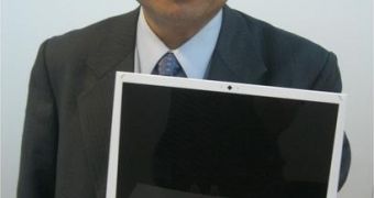 ASUS' CEO, Jerry Shen, holding a shell of the upcoming AIRO laptop