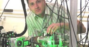 Image of graduate student Adam Caprez firing the pulsing laser