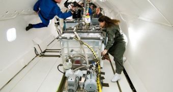 NASA engineers test the EBF3 system during a parabolic flight, in 2007