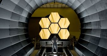 NASA engineer Ernie Wright looks on as the first six flight-ready JWST primary mirror segments are prepped to begin final cryogenic testing at the NASA Marshall Space Flight Center