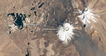 This orbital image of twin volcanoes in the Andes Mountains was collected on October 7, 2011
