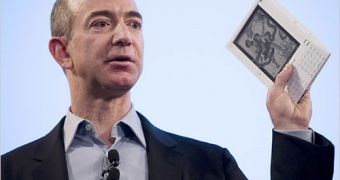 Amazon's Chief Executive Jeff Bezos, holding Kindle