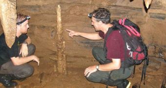 FIT professor Mark Bush (right) and undergraduate researcher Christopher LaDrew discuss a stalagmite in Santiago Cave, Ecuador. The area reveals the influences exerted on the Amazon