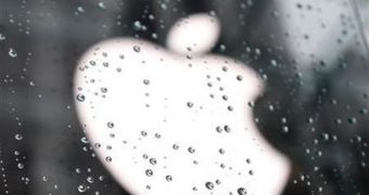 Apple logo behind wet glass