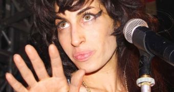 Amy Winehouse will not headline London music festival, puts comeback on hold indefinitely