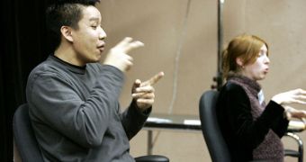 Sign-language interpreters gesturing