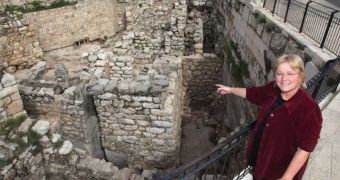 Dr. Eilat Mazar points to the tenth century B.C.E. excavations that were uncovered under her direction in the Ophel area adjacent to the Old City of Jerusalem