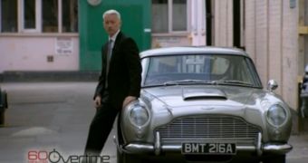 Because he can’t drive stick, Anderson Cooper just leans on James Bond’s Aston Martin