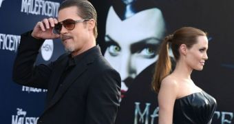 Brad Pitt and Angelina Jolie color-match on the red carpet at Disney’s “Maleficent,” in which she played lead