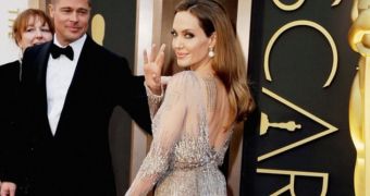 Angelina Jolie’s Oscars 2014 dress revealed some of her very extensive body art