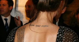 Angelina Jolie loves tattoos, has at least 13 of them all over her body