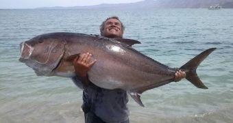 Kevin Shiotani latches on to his giant amberjack