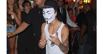 Anonymous is not happy that Justin Bieber decided to wear a Guy Fawkes mask