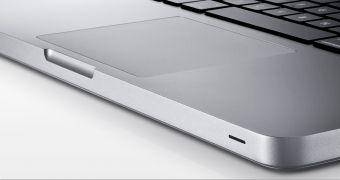 Apple's new, 13-inch MacBook (glass trackpad and neat design emphasized)
