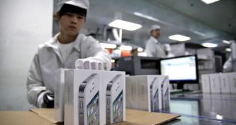 Foxconn employee preparing iPhones for shipping