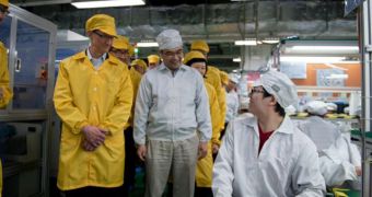 Apple CEO Tim Cook visiting a Foxconn factory