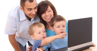 A happy family using a computer