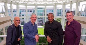 Cook, Cue, and the Beats founders having their picture taken in the Apple HQ