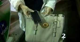 Atlanta woman shows her recovered iPhone 4 and purse to WSB-TV