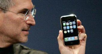 Steve Jobs, iPhone in hand