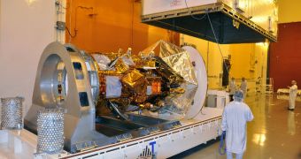 The Aquarius/SAC-D spacecraft is unpacked and unveiled at the VAFB Spaceport Systems International payload processing facility