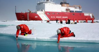 The USCG cutter Healy is in the background, while scientists collect samples from the Arctic Ocean in this 2011 ICESCAPE image