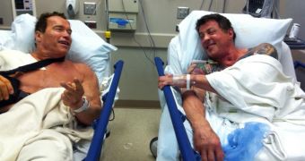 Arnie and Sly chill in the hospital, probably promote upcoming flick “The Tomb”