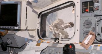 Image of Rick Linnehan during the third spacewalk. The image was taken from the window located in Endeavor's aft flight deck