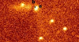 The CTIO picture detailing the peculiar shadow formation: (a) designates the protostar, while (b) marks the position of the potential shadow