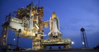 Atlantis is affixed to its launch pad, awaiting takeoff on July 8