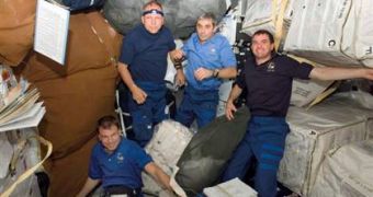 Picture taken on board the Atlantis space shuttle; from left to right, astronauts Stanley Love, Hans Schlegel, Leopold Eyharts and Rex Walheim