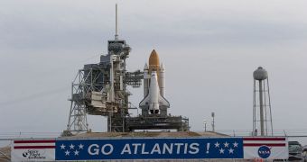 Atlantis is affixed to its launch pad, awaiting takeoff on July 8