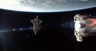 Space shuttle Atlantis is seen here separating from the ISS, early Sunday morning