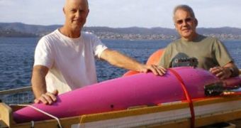 Electronics Engineer Lindsay MacDonald (left) and Oceanographer Ken Ridgway stand with the ocean glider, recovered East of the Tasman Peninsula on Tuesday, after its two-month sampling of the East Australian Current
