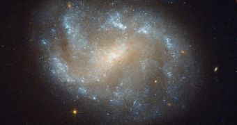 This Hubble image shows the barred spiral galaxy NGC 1483, a part of the Dorado Group
