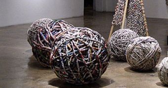 Balls of string made from recycled newspapers, used by an Italian designer to create his wearable works of art