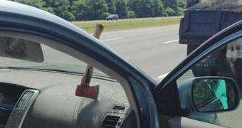Photo shows axe lodged in a car's windshield