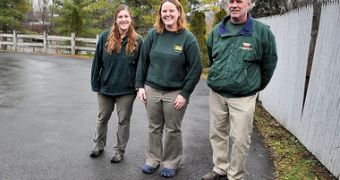 John Moakler, right, Liz Schmidt, middle, and Sarah Kohler, left, helped deliver a baby at the Syracuse zoo
